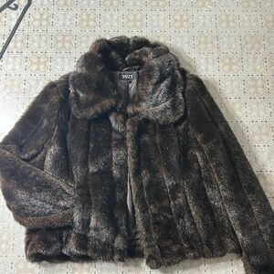 Large sized cropped fur coat. 
Unworn, good condition